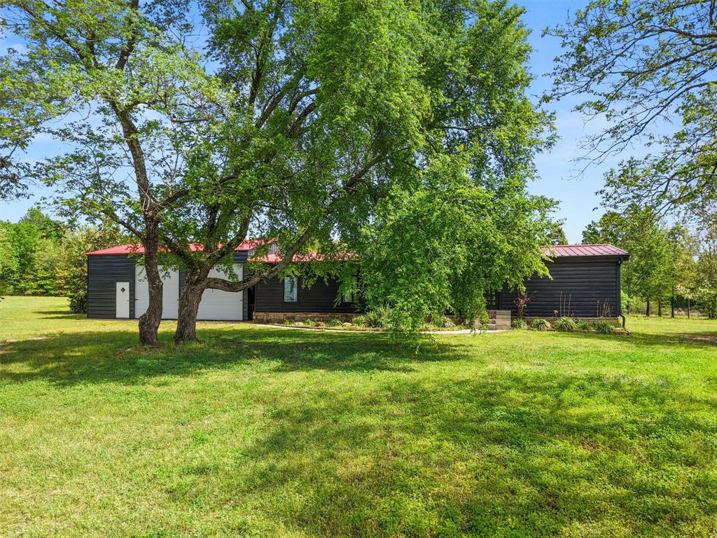 Located in Gilmer ISD in northeast Upshur County, this charming 3-bedroom, 2-bath log-sided home offers the perfect blend of rustic appeal and functional country living. Situated on 9 level acres, the property provides ample space for recreation, livestock, or simply enjoying the peaceful East Texas landscape. In addition to the inviting home, you’ll find a large metal garage, an expansive metal barn, workshop ideal for projects or storage, and dedicated RV storage for added convenience. Outdoor amenities abound, including an above-ground pool for relaxing on warm days and a large, stocked pond perfect for fishing or unwinding by the water. With plenty of room to roam and versatile improvements already in place, this property is a rare find for those seeking space, privacy, and country charm.