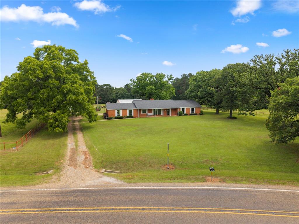 400± Acre East Texas Ranch - Two Homes, 5 Ponds, Pool & More Step into a legacy of East Texas ranching with this remarkable 400±acre property, just 4 minutes from I-30 between Mt. Pleasant and New Boston. Operating as a working cattle ranch since the early 1900s, this land has been thoughtfully maintained and improved over generations — and it's ready for yours. Property Highlights: - 400 acres of fenced and cross-fenced land, ideal for cattle, horses, or recreation - The Original Ranch Home: 3 bed, 2 bath with neutral interiors, granite countertops, panoramic views, and a private pool - Second Home across the FM road — can serve as multi-generational living, rental income, ranch hand home for on-site staff or extra guest accommodations - 5 ponds, private creek, and two wells plus city water access - 100+ year old pecan trees, large garden, and mature hardwoods throughout - 75 acres of pine ready for thinning and export-quality rock on-site for added revenue potential - Export-quality rock located on property for potential income - Two large shops: 24x40and 40x80, perfect for equipment, vehicles, or projects With over a century of cattle production, this ranch combines rich history with endless possibilities — all in a peaceful setting with easy access to schools, shopping, and highways. Land long sought-after for generations and now finally available for purchase, this is your chance to own a true East Texas treasure. Schedule your private tour today.
