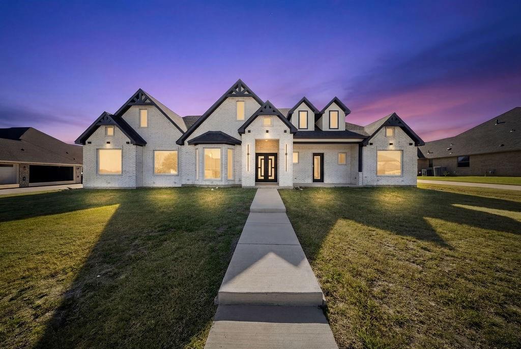 Welcome to 2903 Sunnyside Drive where modern elegance, thoughtful design, and wide-open living come together in one exceptional home. This brand-new custom construction offers nearly 4,000 square feet of beautifully designed space, perfectly situated on just under half an acre in the sought after gated Sleepy Hollow Estates. Step inside and be greeted by a bright, open concept layout featuring soaring ceilings, designer lighting, and a show-stopping living room with a sleek fireplace perfect for gathering with family or entertaining guests. The heart of the home is the expansive chef’s kitchen, complete with a large island, sleek, modern appliances, and abundant cabinetry, all flowing seamlessly into the dining and living spaces.
This thoughtfully designed floorplan includes 4 spacious bedrooms and 4.5 bathrooms, with every bedroom offering walk-in closets for maximum comfort and storage. The private primary suite is a true retreat, featuring a spa-like ensuite bath and oversized walk-in closet designed for both luxury and functionality. Need flexibility? This home delivers with a dedicated office and a large bonus room, ideal for a media room, game room, or additional living space to fit your lifestyle. Outside, enjoy peaceful Texas evenings on the covered patio, Buyer and buyer’s agent to verify all information.