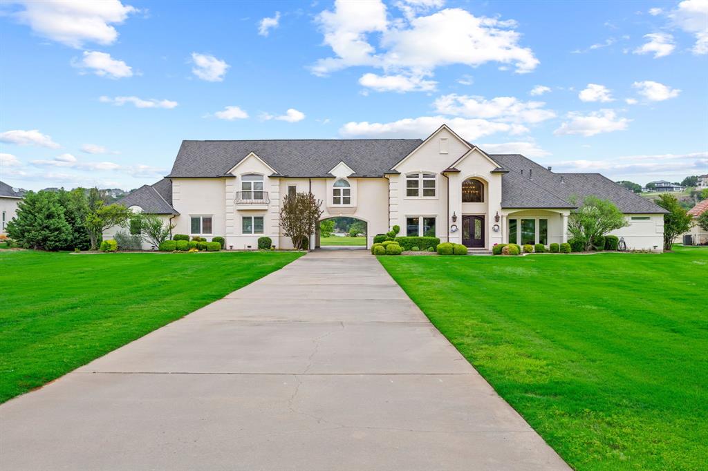 Luxury Lakefront Estate – Entertainer’s Dream!!!

Welcome to this extraordinary 4,680 sq ft custom-built lake house where timeless elegance meets modern luxury. Nestled on over 3 fully irrigated acres of pristine waterfront property, this estate offers an unparalleled lifestyle with breathtaking views.

This stunning home boasts 5 spacious bedrooms and 4.5 bathrooms, including a lavish primary suite with spa-style amenities. Whether you're hosting guests or working from home, enjoy the convenience of a dedicated office and an expansive media room—perfect for movie nights!

Car enthusiasts will be thrilled with the 6-car garage, ample space for your collection! Designed with comfort and relaxation in mind, the home is equipped with a 7-zone HVAC system for individualized climate control, and a powerful 38KW natural gas generator that seamlessly powers the entire home at 100% load during outages. 

Step outside and experience a true entertainer’s paradise. The 25’x50’ resort-style pool and spa is complemented by a fully equipped outdoor kitchen, a cozy fireplace, and generous patio space for year-round enjoyment. Take the short walk down to your 2,000 sq ft premium boat dock, which has room for 2 boats, 2 jet skis, as well as sitting areas, sunbathing deck, and outdoor shower. This dock is ideal for boating, fishing, or simply soaking in the serene beauty of the lake. This property delivers the perfect balance of luxury, functionality, and outdoor living—offering a rare opportunity to own a one-of-a-kind lakefront estate that truly has it all. Schedule your private showing today and experience lakeside luxury at its finest!
