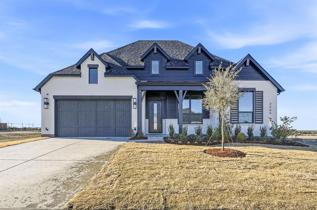 Move-in ready Birchwood Plan! Nestled in the boutique pocket community of Ridge Crossing, residents enjoy amenities including pickleball court, playground, scenic walking trails, low tax rate, & no PID! Situated on a .24-acre homesite, this stunning single-story home offers 2,800+ square feet of thoughtfully designed living space with a 3-car tandem garage. The modern farmhouse exterior features painted brick, black windows, Onyx black roof, cedar garage door, & welcoming covered front porch. Inside, wood flooring & a dramatic entry lead to a private study. All secondary bedrooms include private en-suite baths, plus a convenient powder bath for guests. The entertainment room creates the perfect space for movie nights & gatherings. At the heart of the home, the stunning kitchen impresses with Taj Mahal quartzite countertops & backsplash, dramatic waterfall island, built-in appliances, gas cooktop, glass cabinet accents, a hutch - perfect for entertaining. The dining & family rooms feature soaring 16-foot vaulted ceilings, gas fireplace, & double sliding glass doors opening to the extended covered patio, complete with gas & water lines for a future outdoor kitchen. The private primary suite offers a spa-like bath with freestanding tub, walk-in shower, dual sinks, & large walk-in closet. Additional highlights include spacious utility room with cabinetry & sink. Contact the Sales Team today to schedule your tour!