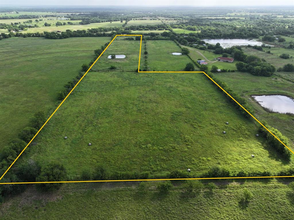 16.3 acres in 2 separate pastures is available for new ownership.  A small pond is in one of the pastures and public water is available at the road. The area also receives a lot of rainfall which is great for vegetation and earthen tanks. This property features roughly 248 feet of frontage on VZ County Rd 3504.  The fertile soil has historically produced a lot of hay for hay production, which also makes it ideal for grazing livestock. New construction is underway in the area as the immediate neighbor just built a horse barn, and the neighbor across the road is building a barndominium. Located just over an hour from downtown Dallas, 21 minutes from Canton, and 25 minutes from Canton. Some fencing work is needed and sellers may assist with a reasonable offer. Existing hay bales on the property do not convey.