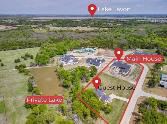 Luxury Estate Opportunity. Private Lake Views. Guest House + Custom Dream Build. Set on 2.53 acres in an VERY EXCLUSIVE gated community in LovejoyISD, this extraordinary property offers a rare chance to complete a custom-designed dream home while living on-site. The 1493sf guest house with lake view is nestled in the trees - a move-in ready retreat while you bring the impressive 6718sf main home to life. Atop a gentle rise with lake views, the main home is already well underway, with high-end design, quality craftsmanship, and a thoughtfully designed floor plan. Expansive windows and sliding glass doors flood the home with natural light while the sleek fireplace, soaring ceilings, and exposed wood beams create a warm, modern luxury aesthetic. Designed for everyday living & entertaining, the open-concept living, dining, and kitchen features a dramatic wall of glass overlooking the future outdoor living space with multiple covered patios and a pool. The chef’s kitchen includes a statement island, custom cabinetry, pot filler, and dual-pantry - complete with a prep kitchen designed for high-end appliances such as a built-in coffee system & full-size wine fridge. The primary retreat offers a spacious sitting area with patio access, spa-inspired bathroom with steam shower, dual vanities, and space for a freestanding tub. With 5 bedrooms, 5 full & 3 half baths, the home includes a study with a hidden room, media room, recreation room-pool house, hobby room, and distinct wings for family and guests. The children’s wing features two ensuite bedrooms with walk-in closets and its own living area. ***The Guest House with 2-bed 2-bath +study has full kitchen, custom cabinets, island, open living and dining.*** With substantial construction already complete, this property offers a unique blend of immediate livability and future customization—allowing the next owner to finish the main home to their discerning vision while enjoying a high-quality residence from day one.