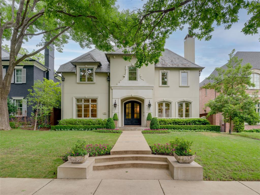 The warm transitional style of this Highland Park home has broad appeal. Foyer is flanked by a dining room and large living area with adjacent butler’s pantry, perfect for entertaining. Warm hardwood floors and 11ft ceilings throughout lower level of the home. Kitchen features Wolf and Subzero appliances, dual dishwashers, oversized quartzite island, and additional butler’s pantry. Spacious den and great room have French doors opening to a terrace with automated screens. Primary bedroom features limestone fireplace and French doors leading to a Juliet balcony. Four additional bedrooms on upper level. Features of home also include a slate roof, elevator, and third floor attic space. The yard, with mature landscape and privacy, has heated spa, cast stone fireplace, outdoor kitchen, and landscaping by Harold Leidner. Unparalleled location close to several parks, the shops and restaurants of HP Village, the Katy Trail, and Armstrong Elementary School.