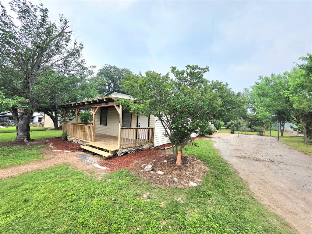 3BR, 1.5BA home on a .53-acre lot. Features a 20 x 24  workshop with electricity, a greenhouse, and a gazebo. The beautiful yard boasts mature trees, and the deep lot benefits from frontage on both the front and back roads. The entire house plumbing was updated with PEX several years ago. Recent upgrades include a new HVAC system and metal roof installed in 2024 and new flooring throughout the home in the last few weeks.  There is a large laundry room, a covered front deck, and a large back deck. The seller is a licensed real estate agent.