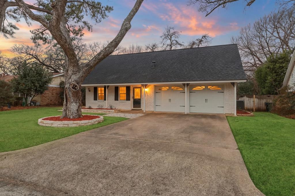 Welcome to 806 Waggoner Drive, a charming two-story traditional home nestled on an oversized interior lot in the established Briarwood West neighborhood of central Arlington. Built in 1963, this well-maintained residence offers 1,674 square feet, 3 bedrooms, 2 bathrooms, and multiple living spaces designed for comfortable everyday living.

The main level features a spacious family room anchored by a cozy fireplace, creating a warm and inviting atmosphere for gatherings. The kitchen offers built-in cabinetry, pantry storage, and efficient functionality, flowing easily into the dining area for casual meals or entertaining. A convenient half bath and utility room complete the first floor.

Upstairs, the primary suite includes an ensuite bath with dual sinks, separate vanities, a walk-in shower, and generous closet space. Two additional bedrooms also feature ceiling fans and walk-in closets, providing flexibility for family, guests, or a home office.

Situated on approximately 0.225 acres, the property boasts a large, private backyard with wood privacy fencing—ideal for outdoor entertaining, pets, or future enhancements. Covered patio and deck areas extend the living space outdoors and features a full coverage mosquito misting system, while a two-car front-entry garage provides ample parking and storage.

Located within Arlington ISD and just minutes from schools, shopping, dining, and major roadways, this home presents an excellent opportunity for owner-occupants or investors alike.