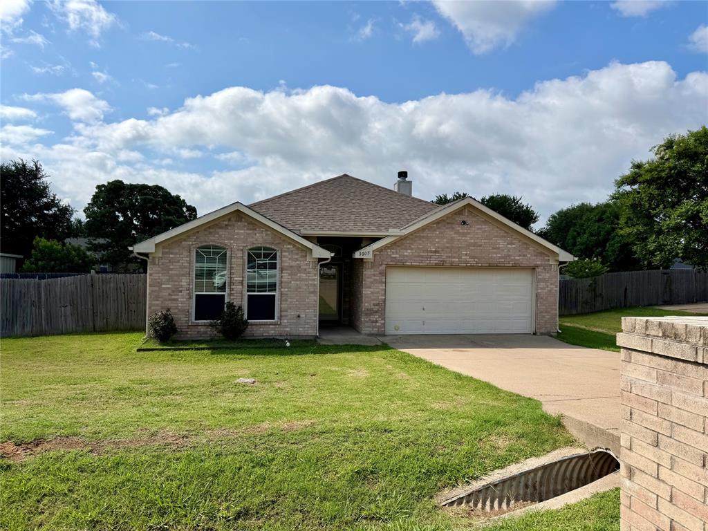 Welcome to this beautifully updated 4 bedroom, 2 bath, 2 car garage home offering 1,806 square feet of well-designed living space in the desirable Mander Estates community. Built in 2005, this home features a smart split-bedroom arrangement that provides added privacy between the primary suite and secondary bedrooms.

The heart of the home is the spacious kitchen, showcasing smart double ovens, a large island with seating for six, a built-in desk, and abundant storage, making it ideal for both everyday living and entertaining. Wood-look tile flooring flows through the main living areas, while the living room is anchored by a cozy wood-burning fireplace.

Step outside to enjoy a large, privacy-fenced backyard with a covered patio, perfect for relaxing, grilling, or hosting gatherings. Residents of Mander Estates enjoy access to multiple parks, sport courts, and a large fishing pond, all just minutes from Lake Granbury, shopping, dining, entertainment, and the historic Granbury Square. This home offers comfort, convenience, and lifestyle in an established Granbury neighborhood.