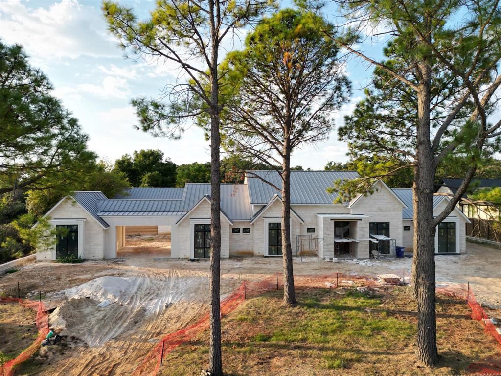Discover luxury living in this sprawling 5,887 sqft single-story home built by Cambium Custom Homes. Boasting 3 distinct living spaces: a cozy family room, dynamic game room, and media room - it's designed for ultimate comfort & entertainment. The kitchen is a culinary haven with a stone temperature-controlled wine display, overseeing the elegant dining area and prep kitchen equipped with extra appliances and ample counter space. Decorative tape lighting enhances the home's ambiance, while sliding doors lead to the expansive back patio featuring a fireplace, built-in grill, and a seamlessly connected bar, perfect for indoor-outdoor gatherings. Nestled amidst the 30-foot mature pine trees, the home welcomes you with a picturesque entrance, offering a serene arrival experience. Retreat to luxurious comfort, where every detail is thoughtfully designed to elevate your everyday living experience. *The photos are a reference of a Cambium build out and not of the listed property.*