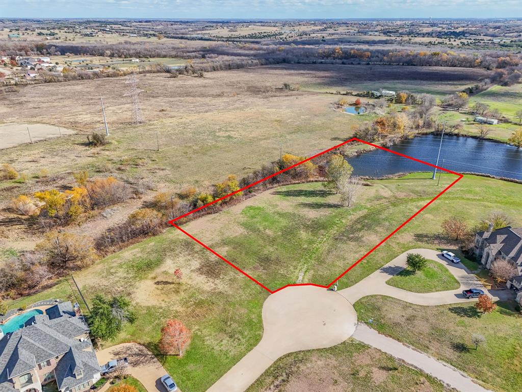 OPPORTUNITY, LOCATION, RARE FIND!!........This home site is PERFECT, Quant nice neighborhood, Close to Heath & Forney.  These exquisite and homes are on a private road located in a small addition with great people.  The tranquility of this area is none like any other, yet close to what ever you need.  At night you can hear all the fun noises from different types of night animals, Owl's, rabbits, and others.  Plus the awesome view of the pond in back of property.  Come see you will Love it.