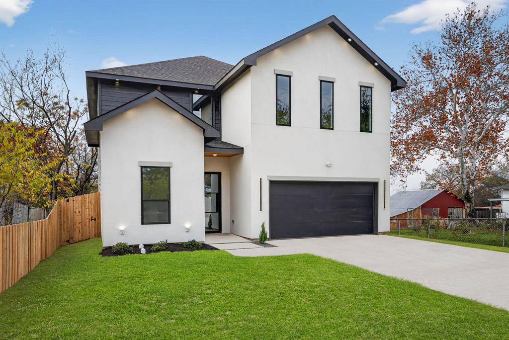 Welcome home to this beautiful modern new construction home featuring 4 spacious bedrooms, 3 full bathrooms and a flexible den that could be used for a home office or lounge. The primary suite on the first floor boasts comfort and privacy, while soaring 20  ft ceilings fill the home with natural light and an open, airy feel. The kitchen is a true centerpiece with custom cabinetry, Taj Mahal quartz, a waterfall island and Samsung appliances for both everyday living and entertaining. Step out onto the second floor balcony with scenic city views. Centrally located minutes from Trinity Groves and Bishop Arts and Downtown Dallas. To make it even more special, the builder is including a free custom accent wall of the buyer's choice, adding a personal touch to this exceptional home.