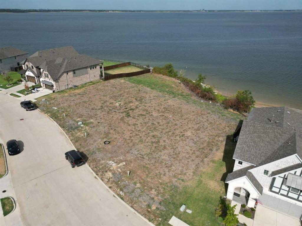 The property is currently listed below its appraised value according to Kaufman County records.

It's very rare to find land that is not only lakefront but also allows you to build your dream house almost on the water. It has a European Mediterranean village feeling, with incredible sunset views of downtown Dallas ,that you can enjoy all year long. All the utilities are already available, and the land is ready to be built on with no deadline for construction. You can choose your own builder; the owner has plans that he can give for free and can also recommend a builder to the buyer. Additionally, a community pool is available for residents.