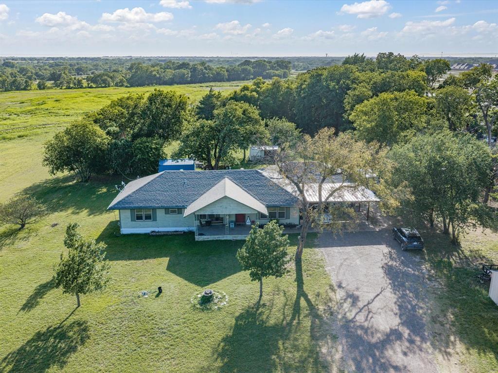 Welcome to 301 Ovilla Road — a charming ranch-style home that delivers the peace and space of country living while remaining conveniently inside Waxahachie city limits. Nestled on 2.8 beautiful acres, this classic three-bedroom, two-bath home offers room to breathe, room to grow, and endless possibilities.

Inside, you’ll find a warm and inviting layout featuring a spacious converted den — formerly the garage — adding valuable flexible living space perfect for a family room, home office, or entertainment area. The home’s classic ranch architecture means easy single-story living with a covered front porch ideal for enjoying the view. 

The home has that welcoming feeling, but ready for your preferences and updates- paint, colors, etc.
With new subdivisions developing nearby and commercial-zoned businesses in the area, this is a location on the rise.

Investors and entrepreneurs, take note: while the property is currently zoned residential, its proximity to commercial activity makes it worth exploring potential opportunities — buyers are encouraged to conduct their own due diligence regarding possible non-residential use.