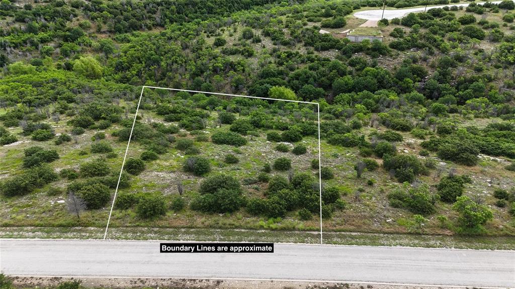 Build your dream retreat on this spacious unimproved lot located in the heart of Graford, TX. Offering endless possibilities, this property provides the perfect blank canvas to design a custom home or getaway that fits your vision. Surrounded by the natural beauty of Palo Pinto County, you’ll enjoy peace, privacy, and a true Texas landscape. Conveniently situated near Possum Kingdom Lake, outdoor enthusiasts will appreciate quick access to 18- hole Championship Golf course, marina for boating, fishing, hiking, sandy beaches, tennis and so much more! Whether you're looking for a weekend escape or a long term investment, this lot offers exceptional potential. Dont miss this opportunity to create your own piece of TEXAS LIVING!