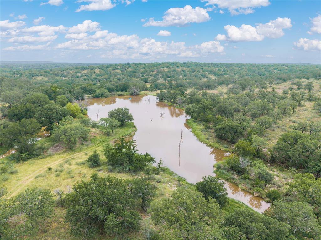 Country Ranch and hunting paradise on 333.17 acres in San Saba County for sale.  This beautiful diversified property has a Richland Springs address and is located less than a mile from where County Road 266 runs into the Colorado River at Keys Crossing.  There is 100+- acres of improved coastal grass with 84' x 90' and 75' x 60' cattle working pens.  This pasture is cross fenced, has a pond, water troughs and Richland Springs Special Utility District service.  There is 2769' of road frontage on County Road 266, if a new owner would like to develop or subdivide the acreage. 

As you move up through the property there is the secluded 1980 Manufactured Home boasting 1344 sf with 3 bedrooms and 2 full baths.  The kitchen, dining and living room area has an open concept feel. The home will come fully furnished and be ready for the next owner to be able to set up either a permanent residence or have a camp house ready for hunting season.

The large yard area is separated from the pasture and other acreage that is used primarily for cattle and excellent hunting.  This area has a 12' x 19' cabin bunk house that is furnished and can sleep 4-6 people,  a newer 14' x 24' storage building that is ideal for a shop or ATV storage, 10' x 16' storage building, additional storage building, green house and a 2520 sf pole barn for tractors and farm implements.

The remaining fenced 233.17 +- acres can be used to run cattle, but is mainly used for hunting.  This area comes with a 2+ acre small lake, a pond and an additional shared pond on the south fence line.  The south boundary is fenced.  The property has several internal roads and trails for easy access to all areas.  There are many quality spots for hunters to set up blinds and feeders. 

This well-diversified property has many possibilities for a new owner.  Located within 20-45 minutes of San Saba, Brady, Rochelle, Richland Springs, Brownwood and Goldthwaite.