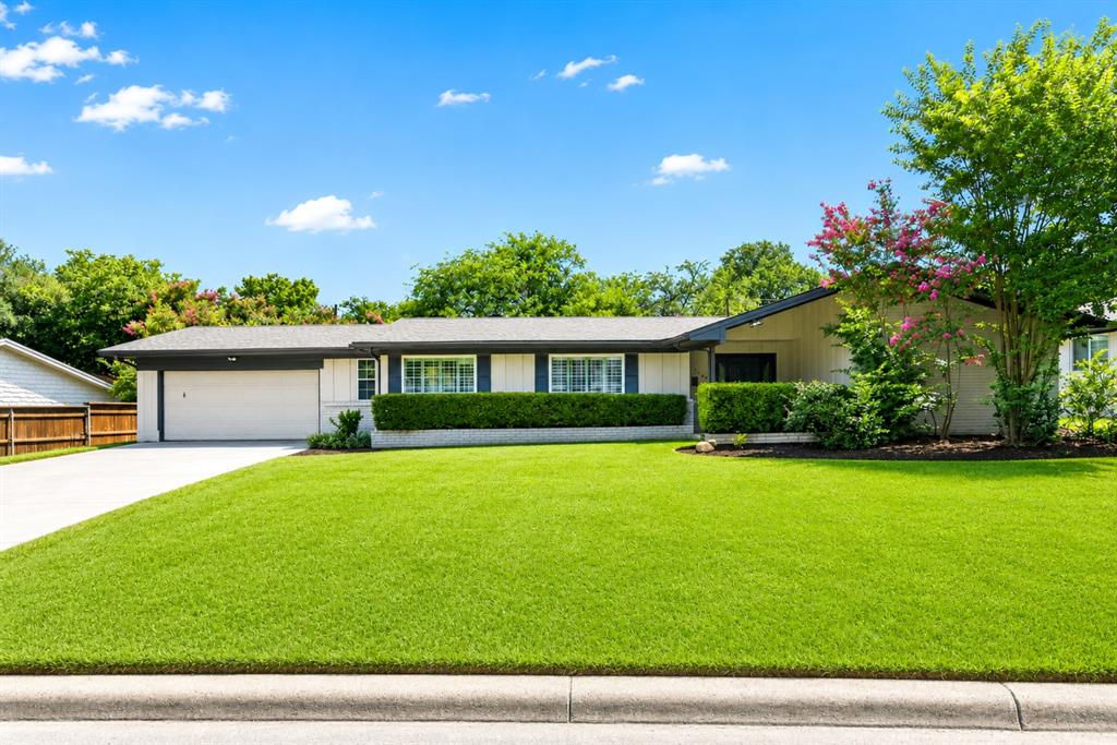 Zoned for Overton Park Elementary, this 1960 brick ranch in Fort Worth's Westcliff neighborhood features 4 bedrooms, 3 bathrooms, and 2,272 square feet of living space on a 0.26-acre interior lot. The layout includes two separate living spaces, a wood-burning fireplace, and a formal dining room. The kitchen has new countertops, modern appliances, and a breakfast nook. The primary suite offers walk-in closets and an attached bathroom. The home features new engineered hardwood and carpet flooring throughout. Outside, the grass backyard has an open patio, mature trees, and space for a pool, plus an attached two-car garage.