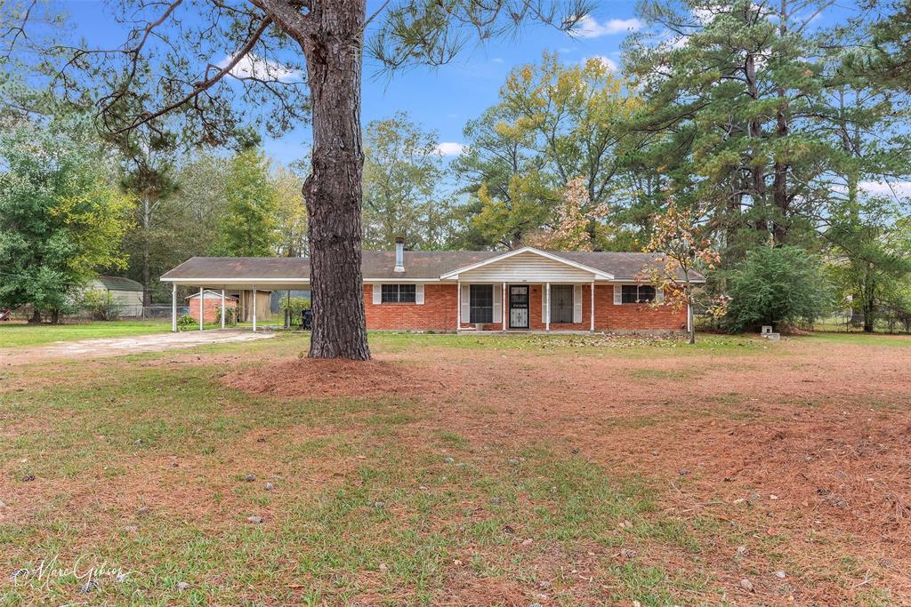 OVER 2.5 ACRES! Come make this home your very own! With over 2.5 acres, there aren't many neighbors and it is nice and peaceful! The home has 3 bedrooms and 2 bathrooms along with a great size eat in kitchen and what could be 2 living rooms. There is a 2 car carport and lots of space to do whatever you want!