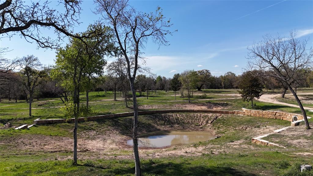 Discover the rare opportunity to own a spacious homesite in a new community designed for privacy, natural beauty, and long-term enjoyment. This generously sized 10 + acre lot is thoughtfully positioned to maximize seclusion, preserve views, and create a seamless connection with the surrounding wooded landscape. Each homesite provides the perfect canvas for a custom home—whether it’s a contemporary estate, a refined Texas getaway, or a residence that integrates effortlessly with nature. Expansive acreage ensures space between neighbors, offering quiet, tranquility, and freedom to live on your terms. Enjoy mornings with uninterrupted sunrise views, evenings framed by soft sunsets, and weekends that feel truly restorative. More than just land, these homesites provide the foundation for a lifestyle defined by space, beauty, and lasting privacy.
Outside City Limits. Ag Exempt. Entry lake negotiable and would add an additional 1.141 acres to make an estimated total of 11.421acres.