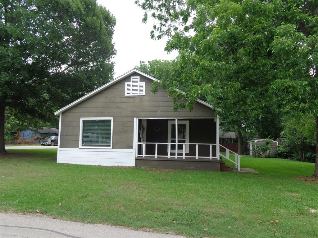 Welcome home to this charming, updated 2-bedroom, 1-bath home situated on a spacious corner lot in the heart of Grandview. Featuring original hardwood floors, an updated bathroom, newer windows, and an HVAC system approximately four years old, this home offers comfort and character. The large eat-in kitchen and convenient mud room provide functional living spaces, while mature trees add shade and curb appeal. Located within walking distance of schools, parks, and downtown Grandview, this property is ideal for first-time buyers, those looking to downsize, or investors seeking a great opportunity in sought-after GVISD. Seller is motivated!