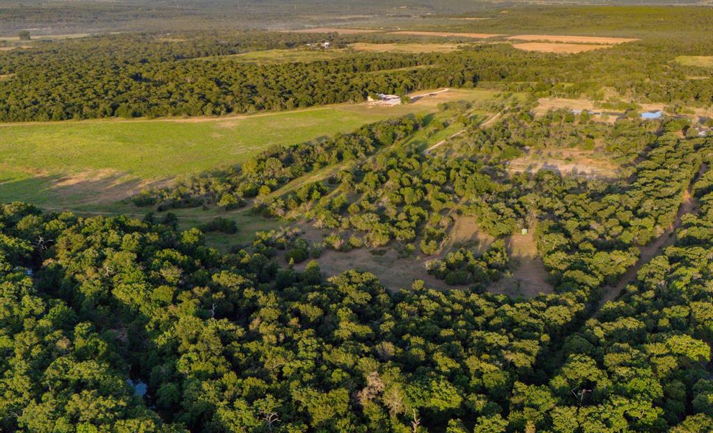 The Salt Creek 48  – Teague Lane, Jack County, TX

Located in the Salt Creek Valley of southern Jack County, this 48.43-acre tract features two distinct and diverse land types.  The western two-thirds is gently rolling pasture featuring native grasses, mature post oaks, mesquite, and locust trees, as well as a stocked pond. The eastern third is heavily wooded bottomland, cut in two by Salt Creek. Pools in the creek hold water year-round, but it flows heavily with the spring and fall rains.  Large boulders line the banks, and wildlife sign is plentiful.  The beautiful topography of the northern hill country on neighboring ranches enhances the feeling of solitude. 



Access: Frontage on county-maintained Teague Lane, approximately southwest of Jacksboro 



Water Features: Half-acre stocked pond and approximately 775 ft of Salt Creek frontage – both offer seasonal fishing and reliable wildlife water sources. 



Terrain & Cover: Gently rolling, with a mix of open grassland and native hardwood cover suited to wildlife habitat 



Wildlife: Whitetail deer, feral hogs, wild turkey, plus various small and upland game species



Utilities: No improvements on site; electricity available nearby 

Potential Uses: Hunting tract, recreational use, weekend getaway, or possible home site 

School District – Graford ISD This property falls within the Graford Independent School District, a small rural PK–12 district headquartered in Palo Pinto County (serving portions of southern Jack County). Graford ISD has one campus serving about 330 students from preschool through 12th grade, with an overall student-teacher ratio of roughly 9:1. 

Summary: A no-frills, ready-to-use recreational tract featuring solid water, terrain, and wildlife amenities. Perfect for outdoorsmen or those seeking a secluded weekend escape with access to Graford schools serving pre-K through high school.