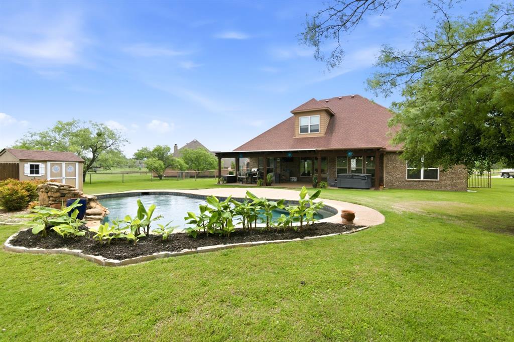 Welcome to this country retreat on 1 acre in acclaimed Aledo ISD with no HOA.   Nestled on a quiet cul-de-sac in the desirable Hills of Aledo, this thoughtfully designed home offers the extraordinary blend of comfort, space, and outdoor living. Inside, you’ll find an open-concept floorplan with split bedrooms, warm and spacious living area, decorative lighting, and a gourmet kitchen featuring granite countertops, double oven, stainless steel appliances, island, breakfast bar, and abundant cabinetry.

The private primary suite is a true gem with ornate tray and vaulted ceilings, dual vanities, separate tub and shower, and an enormous walk-in closet complete with a sitting area—perfect for a dressing, reading nook,  or private moment.  Flexible upstairs bonus room includes walk in closet space which may be utilized as 4th bedroom, game or media room, guest suite, or second living area.

Step outside to your backyard oasis featuring a sparkling in-ground pool and an impressive covered patio with pebbletec finish designed for year-round enjoyment. This expansive outdoor living space offers endless possibilities for entertaining, outdoor dining, relaxing by the pool, hosting game day gatherings, or creating your dream outdoor kitchen. With plenty of room to spread out, it’s the ideal extension of the home for enjoying Texas evenings.

Additional highlights include side-entry garage, well and aerobic septic, and a peaceful country feel just 10 minutes south of I-20 off Hwy 5, experience this rare opportunity to enjoy space, privacy, luxury amenities, and top-rated schools! New roof to be installed onced under contract.