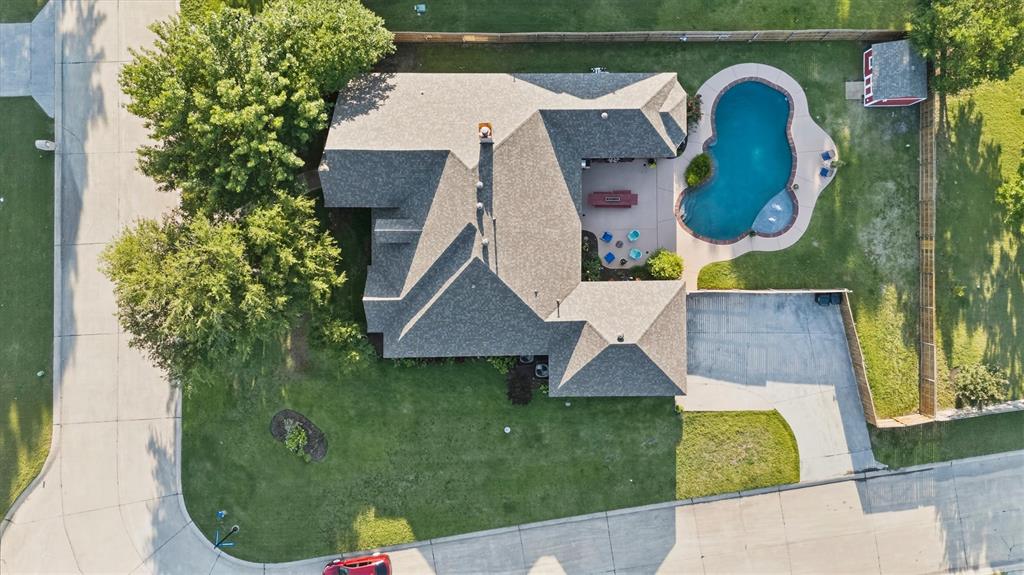 Gorgeous home on a .34 acre corner lot with a beautiful inground pool. Located in the heart of Lucas in Lovejoy ISD, the Commons of Camden is a smaller neighborhood with a slower pace that's just minutes from Lake Lavon with easy access to shopping and dining in Allen and Wylie. This traditional, one owner home has been well cared for and has been updated in all the right places. Featuring an open floor plan with 2748 sq ft, 4 bedrooms and 3 baths, formal dining room and a study. The family room has tall ceilings, a wood burning fireplace with shiplap accents, and a wall of windows that overlook the backyard. Awesome kitchen with a center island, ample counter and cabinet space and double ovens.  Spacious primary suite with tray ceiling, large closet, updated bathroom with dual sinks, jetted tub and walkin shower. Split bedrooms, hardwood floors, built ins, great natural light, small storage building, covered patio, outdoor sitting areas and more. This really is a great home, perfect for entertaining or just a wonderful place to relax and unwind after a busy day plus you can't beat cooling off in a sparkling pool on a warm Texas day. Make plans to see this home....it's a good one~~!