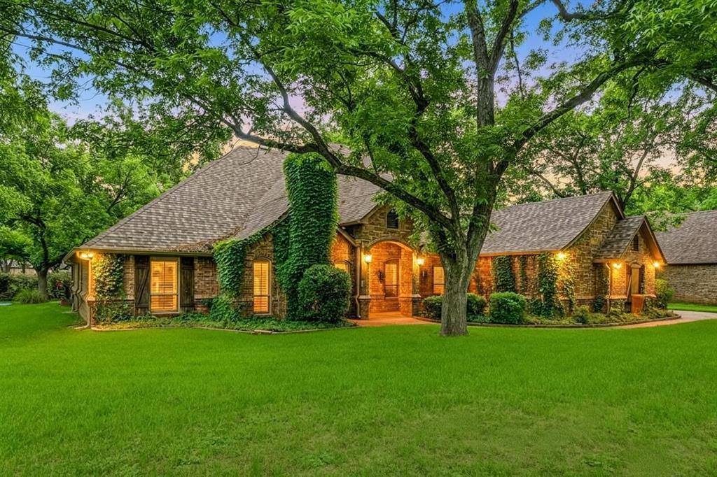 Welcome to an extraordinary custom built residence in the prestigious Pecan Plantation community, where timeless elegance and exceptional craftsmanship come together to create a truly remarkable home. From the moment you arrive, the gorgeous exterior and striking curb appeal of this large corner lot set the tone for what awaits inside.

Step through the doors to discover rich woodwork and custom details woven throughout the home, creating warmth, sophistication, and character in every room. Designed for both luxurious living and comfortable everyday life, this home features three fireplaces that add charm and ambiance across multiple living spaces and kitchen.

The dedicated office or library is nothing short of impressive. A refined retreat ideal for working from home, hosting clients, or simply enjoying a quiet space with beautiful architectural detail. Expansive living areas flow seamlessly into the heart of the home, offering the perfect setting for entertaining guests or gathering with family.

One of the standout features is the incredible screened-in covered patio, providing a year-round outdoor living experience where you can relax, entertain, and enjoy the beauty of the surrounding property in comfort and style.

This home features an oversized double garage with an additional 3rd garage that has been heated and cooled. Walk up stairs in garage lead to an impressive attic that is decked for abundant storage.

Located within one of North Texas’ most sought-after gated golf course communities, residents of Pecan Plantation enjoy an unmatched lifestyle with access to golf, dining, parks, recreation, airstrip access, equestrian facilities, and more. This is more than a home — it’s a lifestyle defined by luxury, comfort, and community.