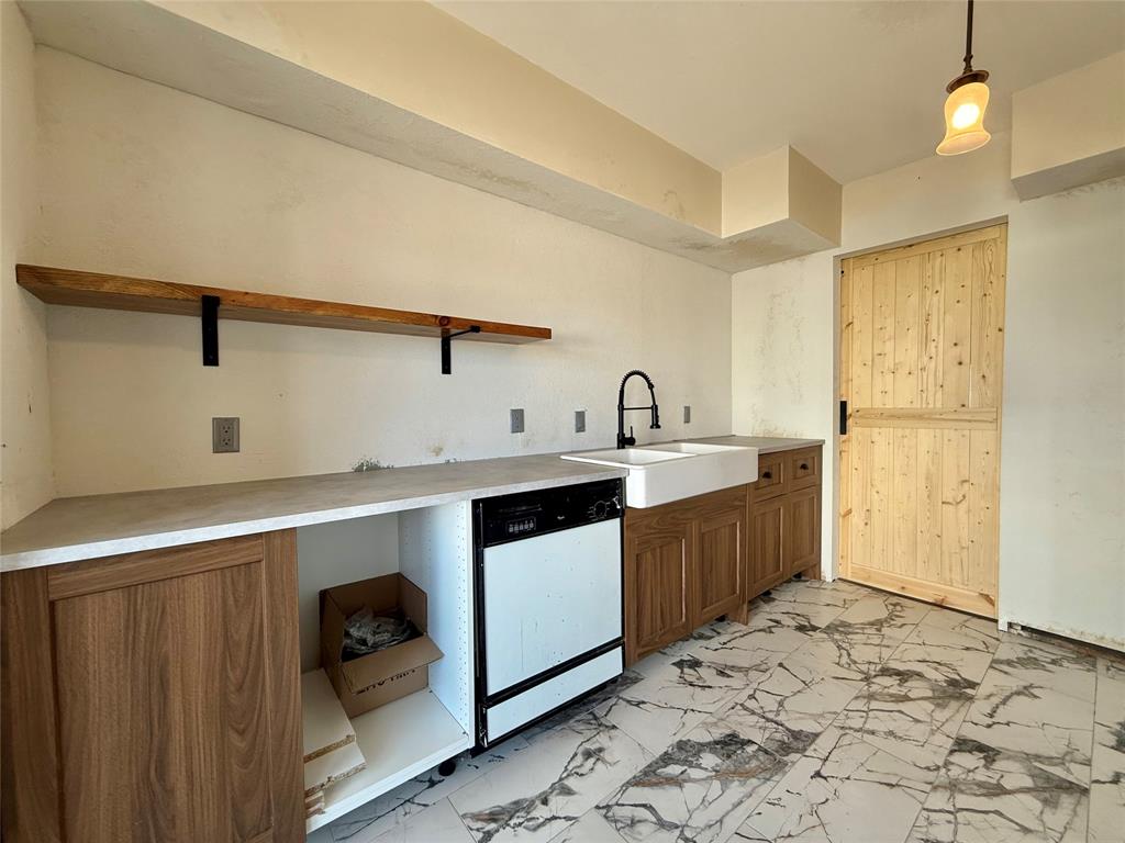FULLY Gated Intimate recently renovated complex - HOA INCLUDES ALL UTILITIES, Secured 1 Covered Parking space, unit overlooks pool from a good distance, Quick access to covered parking spot, Balcony off of kitchen to eat al fresco. NEW Kitchen cabinets, NEW 99% fully renovated! Finish off light kitchen and optional bathroom remodel - place tenant asap! Heart of everything Dallas! Less than 10mins to SMU-North Park-Katy trail, Values are promising to hold to resell for profit! Live in unit & remodel at the same time! NEW decorative tile flooring in all wet areas, 2 NEW barn sliding doors, NEW hardware everywhere, NEW kitchen remodel with offering farmhouse sink & floating shelves, NEW paint, NEW Woodlike Luxury Water resistant flooring, NEW light switches, NEW garbage disposal, NEW cabinets, NEW microwave, Unit offers front and back patio! Jack and Jill bathroom w.close door stackable laundry & 2 Separate vanities, Good size Pantry, deep closets, extra storage in bathroom. Prime location minutes from Trader Joes, Presbyterian, Medical City Hospitals, Shopping, Dining, North Park Mall, Entertainment, Mature neighborhoods offering homes in the millions+. NEW COMPLEX UPGRADES include: NEW roof, all NEW windows, NEW exterior painting, NEW electrical panels, NEW guttering and French Doors. New landscaping in courtyard and surrounding areas, 986sf roguhly...