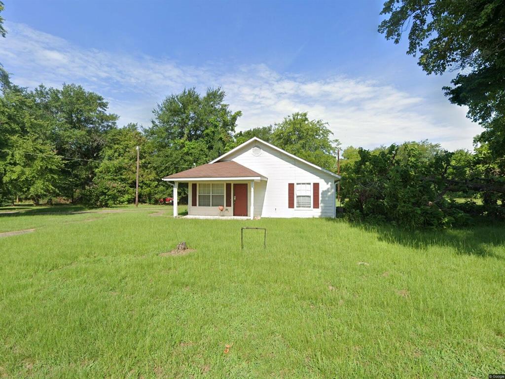 Investment opportunity in Gilmer, Texas! Sitting on approximately 1.29 acres near town and close to the highway, this property offers excellent potential for rental income, future development, additional homesites, duplexes, or investment expansion opportunities.

The property includes a 2 bedroom, 1 bathroom home with approximately 780 square feet, updated flooring and carpet, plus a detached workshop or storage building with electricity. Whether you’re looking for a rental property, starter home, fixer opportunity, or land with future possibilities, this property offers flexibility and value.

This is an estate property being sold AS IS. Various personal items currently remain on site. Refrigerator is non-working and will need to be removed. Washer is non-working, while dryer remains operational. Furniture and additional items may remain with the property.

Hard-to-find acreage inside town with investment potential makes this one worth a look!