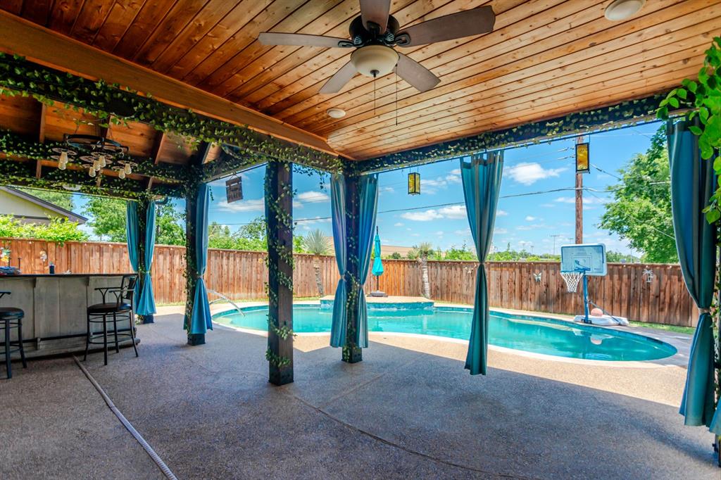 Welcome to 693 Bluebonnet Drive, where resort-style outdoor living, unmatched privacy, and one of America's most celebrated communities come together for under $400,000. Nestled beneath gorgeous, mature shade trees in an established Keller neighborhood, this beautifully maintained 3-bedroom, 2-bath 2 car Garage home offers the character and charm that buyers crave. The private backyard is a true retreat with no homes directly behind you, creating a peaceful setting to enjoy the sparkling resort-style pool, expansive covered outdoor living area, and outdoor bar designed for year-round entertaining. A versatile, detached outbuilding provides endless upgrade possibilities. Create the ultimate home office, craft studio, fitness room, workshop, game room, pool house, man cave, she shed, or hobby space. Bring your imagination and make it your own. Located in Keller, a community that earned national recognition as the #6 Best Place to Live in America, residents enjoy exceptional amenities, beautiful parks, and highly regarded Keller ISD schools. Nearby favorites include Bear Creek Park and The Keller Pointe, while students attend sought-after Keller-Harvel Elementary, Bear Creek Intermediate, Keller Middle School, and Keller High School. Keller's reputation for quality of life, community pride, parks, trails, and family-friendly atmosphere continues to make it one of the most desirable places to call home. From the mature neighborhood setting and incredible outdoor living spaces to the highly acclaimed location, 693 Bluebonnet delivers an opportunity that's becoming increasingly difficult to find in Keller. Privacy, flexibility, character, and value, all for under $400,000. Hurry this opportunity won't last long.  Mors pics coming soon.