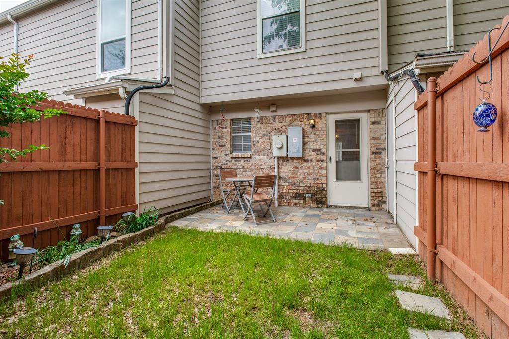 Adorable townhome! Move-in ready. First floor features a open living room, wood flooring, with a wood burning fireplace, a space that could be used as a small dining room and breakfast bar. Kitchen is open to the living room with beautiful granite counter tops, white cabinetry, designated pantry, electric range and built in microwave- All stainless steel. Half bath is located on the first floor. Upstairs provides two bedrooms, the laundry room for convenience of use, wood flooring, natural lighting, and beautiful full bath featuring granite countertops, built in cabinetry, and a tub-shower combo.

Back patio has a wonderful sitting area, privacy fence, and storage unit. Great opportunity!!!