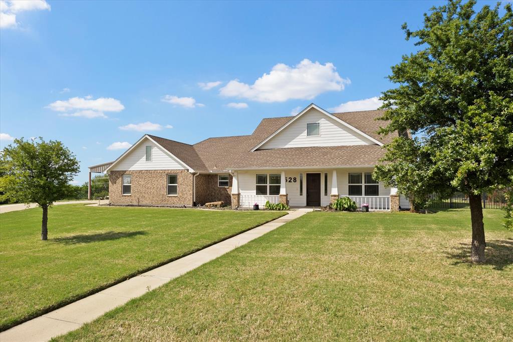 Welcome to this beautifully maintained 4-bedroom, 2-bathroom home offering the perfect blend of comfort, functionality, and exceptional outdoor living—all with the added benefit of NO HOA, NO PID, and NO MUD. Conveniently located just minutes from town, shopping, and everyday conveniences, this property delivers both privacy and accessibility. Designed with flexibility in mind, the home features a versatile formal dining space that can easily serve as a study or formal sitting area. The spacious living room is warm and inviting, centered around a charming decorative wood-burning fireplace. Throughout the home, you’ll find luxury vinyl flooring, NO CARPET, paired with plantation shutters that add timeless elegance, privacy, and natural light control. The gourmet kitchen is ideal for both everyday living and entertaining, showcasing a drop-in cooktop, expansive counter space, abundant cabinetry, and an oversized walk-in pantry. A separate laundry room with built-in cabinetry provides added convenience and storage. Tucked away for privacy, the primary suite offers a peaceful retreat with direct access to the screened-in back patio. The en-suite bath features dual sinks, a large walk-in shower, a soaking tub, and a spacious walk-in closet.
Secondary bedrooms are generously sized, each offering walk-in closets, and are complemented by an updated secondary bathroom with a walk-in shower. Step outside and experience your own backyard oasis, complete with an in-ground swimming pool featuring a swim-up bar that overlooks the covered outdoor living area—perfect for relaxing or entertaining. Situated on a cul-de-sac lot, the property also includes a 24x30 foam-insulated metal shop with 220V power, ideal for a workshop, storage, or hobby space. Don't wait, make this one YOURS!