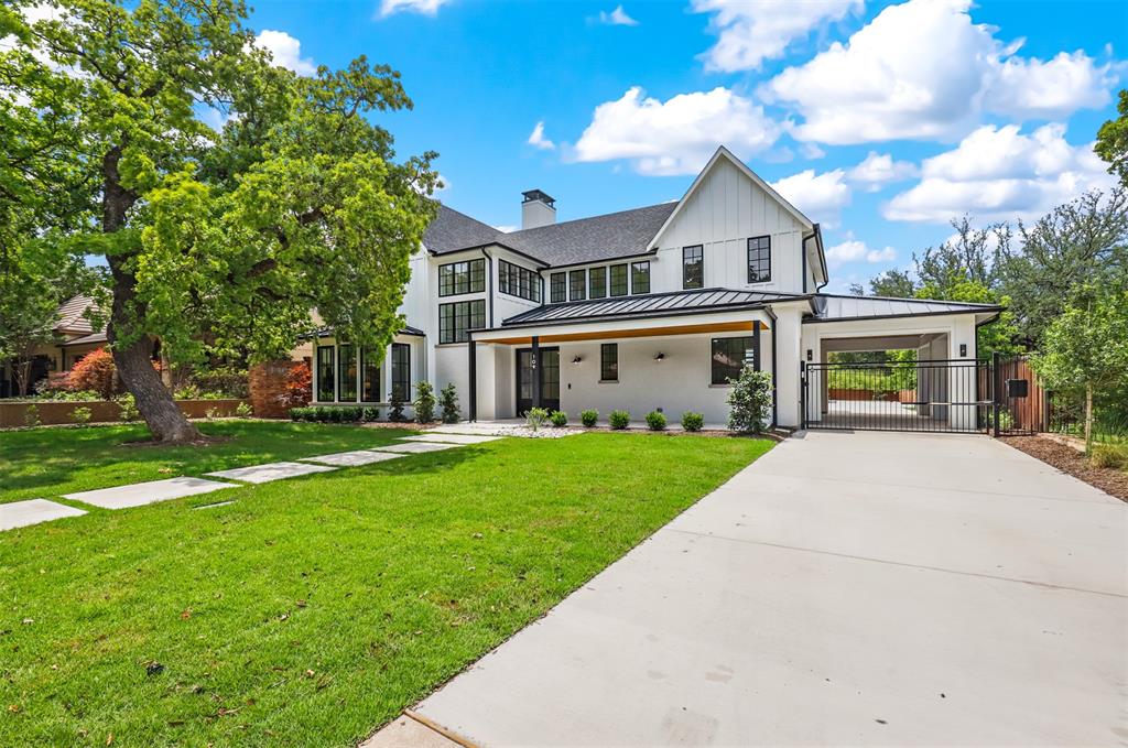 Stunning contemporary home collaboration by Otto Design & Build, Braswell Homes and interior designed by Local Life Design. Built for entertaining in established Crestwood neighborhood. This two-story home wraps around the resort-style pool for incredible views and is complete with a pool house, outdoor kitchen, and stunning landscape. Enter through the custom entry doors, you are met with an expansive open living and kitchen area, surrounded by windows that overlook your outdoor oasis. The luxurious kitchen is complete with quartz countertops, matte maple cabinetry, high-end lighting, and  large butler’s pantry with a secondary sink and wine fridge. The arched doorways, beamed ceilings, and grandiose fireplace provide an immediately desirable atmosphere.  Enjoy your private primary bedroom tucked away on its own wing of the first floor with views of the pool, complete with a stunning en suite bathroom featuring modern finishes, a large walk-in closet, and a luxurious freestanding tub.