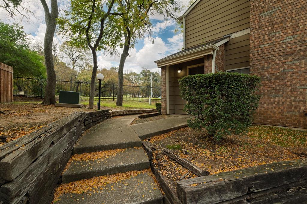 This move-in ready 2-bed, 1.5-bath condo in Willow Brook offers unbeatable value just minutes from AT&T Stadium, Globe Life Field, and Lake Viridian. Ideal for investors, first-time buyers, or commuters, this two-story corner unit has everything you need in a walkable, high-access location.

Step into a bright, open living space with soaring cathedral ceilings and a cozy brick fireplace. The kitchen with breakfast bar flow naturally toward your private, fenced courtyard—perfect for quiet mornings and a cup of coffee. Upstairs, both bedrooms offer large closets and share a full bath. The laundry room upstairs is a great convenience, and the appliances are included. Updates include luxury vinyl plank flooring, fresh paint, new carpet, and move-in ready finishes throughout.

Community perks: assigned parking, full-size in-ground pool, and well-kept grounds. HOA dues cover water, sewer, exterior maintenance, and front yard care. Located in Arlington ISD near Roquemore Elementary and Lamar High, with easy I-30 access for smooth Dallas-Fort Worth commutes. Whether you're looking to live, rent, or invest, this corner condo delivers high ROI in a proven location.