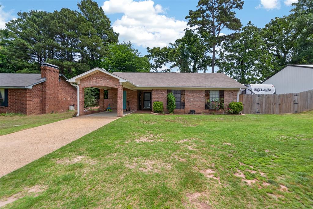 Beautifully updated 3-bedroom, 2-bath home in a desirable Lake Palestine community offering the perfect mix of comfort, style, and functionality. This move-in ready home features a cozy wood-burning fireplace, spacious living area, natural light, and updated finishes throughout. The kitchen offers modern touches, ample cabinet space, and a bright, clean feel perfect for everyday living and entertaining. Step outside to enjoy the oversized backyard and covered back deck ideal for gatherings, grilling, or relaxing evenings at home. A standout feature is the impressive 30x40 heated and cooled metal shop built in 2022— perfect for a workshop, boat storage, hobby space, home business, or extra storage. Conveniently located near LakePalestine, this property offers peaceful East Texas living with mature trees, extra parking, and versatile indoor-outdoor space. A must-see for buyers looking for a family home, lake-area retreat, or property with a shop!