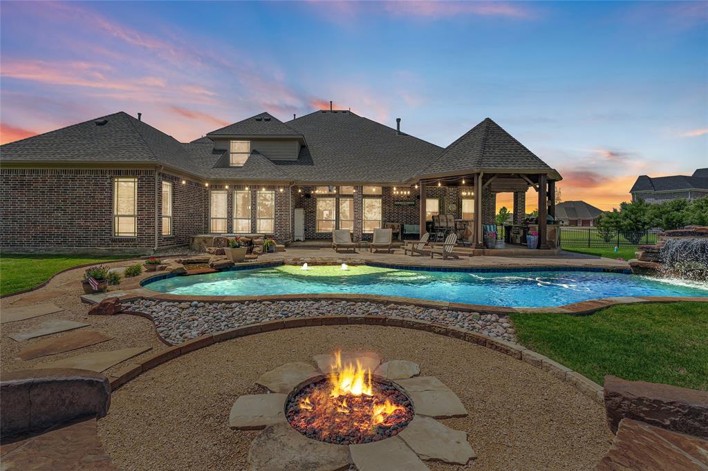 Nestled on 2.64 private acres, this stunning 5 bedroom, 4.5 bath estate with 4664 sq. ft of thoughtfully designed living space with the perfect blend of luxury and tranquility.   Two acres of mature tree lined land behind the home create a breathtaking and unmatched privacy.   Inside, spacious living areas, elegant finishes, and a functional floor plan make this home ideal for both everyday living and entertaining.  Step outside to your own backyard retreat featuring a sparkling pool, relaxing hot tub, and a fully equipped outdoor kitchen, perfect for hosting gatherings year-round.  The impressive 3 car garage with porte-cochere adds both convenience and timeless curb appeal.  Enjoy the peace and privacy of country style living while being just minutes from shopping, dining and everyday conveniences.  This exceptional property delivers the feeling of a private resort while still offering all the comforts of home.