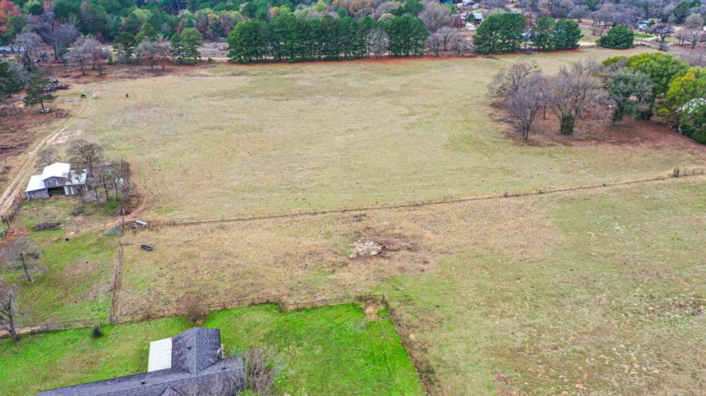 Discover the perfect canvas for your dream home! This beautiful 3 acre lot offers the peace and privacy of country living while still being
conveniently located near Lindale’s schools, shopping, and dining. Situated in the highly sought-after Lindale ISD, this property provides
the space you’ve been looking for, whether you envision a cozy farmhouse, modern retreat, or custom forever home. With plenty of room
for outdoor living, a shop, or a garden, this tract is ready for your ideas to come to life. Enjoy the charm of East Texas country living with
easy access to nearby amenities and quick commutes to Tyler or Mineola