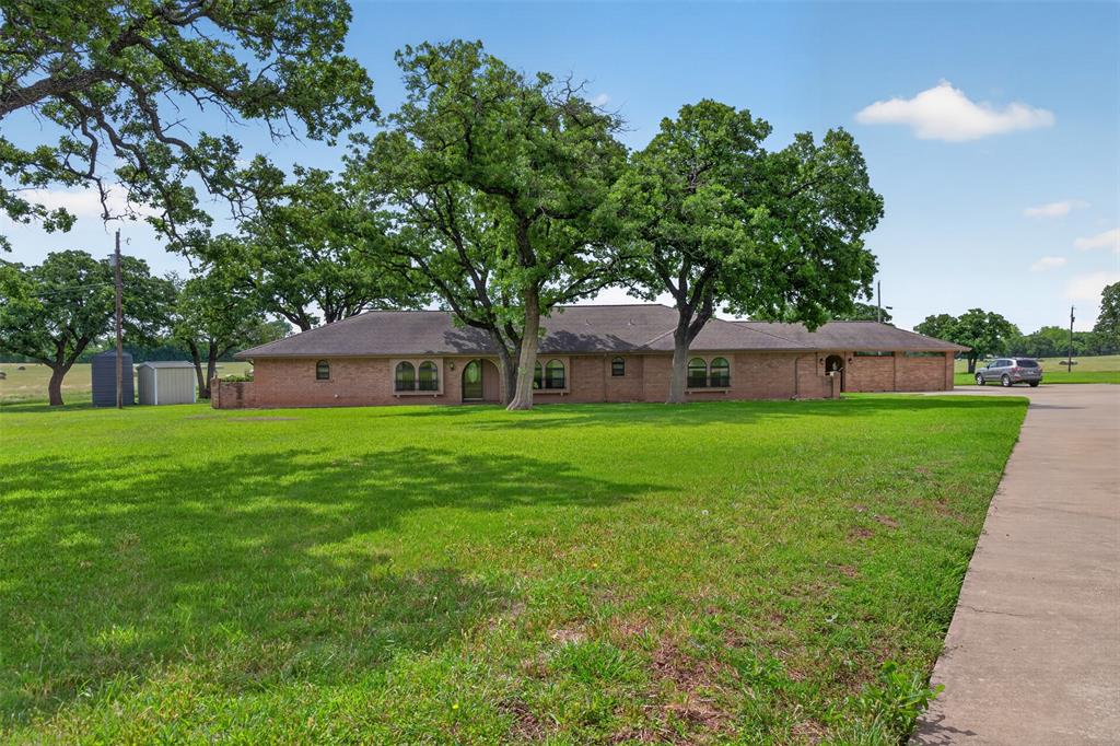 Rare opportunity to own 48 pristine acres featuring a 2,911 SF home just minutes from the conveniences of Burleson—while still enjoying the benefits of being outside the city limits. Ideal for cattle, horses, or other livestock, this exceptional property offers the perfect blend of country living and functional ranch amenities.

The home sits on 2 acres, while the remaining 46 acres benefit from an agricultural exemption and are covered in beautiful, horse-quality coastal grass. A large stocked tank is centrally located on the property and supported by a dedicated well to help maintain water levels. An additional water well services the home-site and can be used for irrigation.

Improvements include a storage shed, covered barn, and rear access from CR 805B, offering added convenience and flexibility. The property consists of 9 contiguous parcels, with the home tucked away on a private cul-de-sac and the expansive acreage extending behind it.

A truly unique and versatile property offering privacy, functionality, and endless potential.