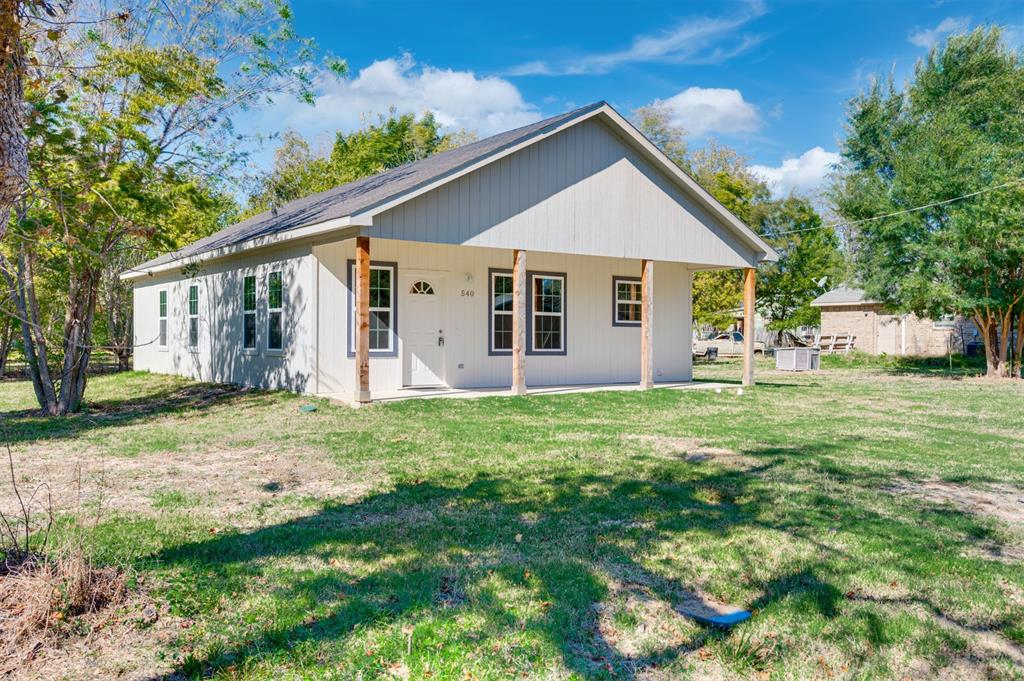 Discover this modern, 3 bed, 2 bath new construction home just a short walk to charming downtown Cooper, TX where you will find great shopping and dining options. The 1,250 sq ft open floorplan layout is perfect for entertaining and flow. The spacious kitchen is equipped with range, dishwasher, microwave, disposal, corner pantry and has room for a dining table. The primary bedroom with plush carpeting is a rest haven at the back of the house and features it's own en suite bath.  The en suite features an oversized walk in shower with tile floor and surround as well as a large vanity and built in linen closet for maximum storage.  The secondary bedrooms are a generous size and the hall bath features a tiled tub shower surround. Wood look luxury vinyl plank flooring throughout the living, kitchen, hall and baths is easy to maintain and looks luxurious. All bedrooms are carpeted with a plush neutral color that compliments the light and bright rooms. Don't miss your chance to own an affordable, move-in-ready home in a desirable location. Truly a must-see!