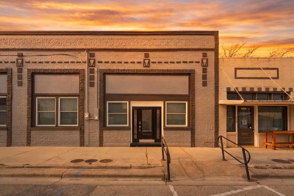 Discover luxury living in this elegantly remodeled 1 bed, 1.5 bath rare townhouse in Historic Downtown Clifton! Completely remodeled from the inside out, with top-of-the-line finishes and thoughtful design, every detail was carefully considered even the ones you can’t see. A 30 in. floor to roof firewall between units, 5-step water filtration system & a high-impact roof.

The kitchen features custom marble countertops, breakfast bar, custom made cabinetry with plentiful storage & stainless steel, energy-efficient appliances—including refrigerator, range, microwave & dishwasher! DuraLux Performance Waterproof Luxury Vinyl flooring runs throughout, complemented by handmade baseboards, crown molding & hand made Beech doors. Double hung windows with custom window coverings allow you to open from the top or bottom. Full size stackable washer & dryer are also!

Designed with accessibility in mind, the home is ADA accessible without looking like it, and includes custom pocket doors hung with industrial materials, walk-in closet with shelving, walk-in shower with a fold up bench & built-in custom cabinetry. The inside walls have been triple sanded and painted with the highest grade paint for a satin smooth finish.

The outside of the building has been painted with high-grade paint to ensure long-lasting durability that resists cracking and peeling through ever changing Texas weather conditions. A custom made outside awning is currently being completed that will run the length of the building with the address permanently placed for the ease of emergency personnel.

Additional features include stylish ceiling fans, Schlage door lock system & individual utilities. The unit has its own address, water meter, & electric meter.

If you love enjoyable restaurants, unique shopping experiences, vibrant festivals & gatherings & an artsy atmosphere, along with a tight knit small town community of business owners & residents, you don’t want to miss this opportunity!