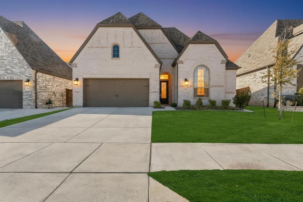 Nestled in the prestigious Wellington community and zoned for top-rated Northwest ISD schools, this stunning 2022-built Highland Home seamlessly blends modern luxury with effortless functionality. The open-concept interior makes a grand impression with soaring 13-foot ceilings and expansive 8-foot windows that flood the living spaces with natural light, highlighting the designer wood-look flooring throughout. At the heart of the home, a gourmet kitchen serves as the ultimate showpiece, featuring a massive 10-foot island, a custom built-in hutch, and premium gas appliances. The primary suite offers a private sanctuary with an extended bay window and a spa-inspired en-suite, while the oversized covered patio provides the perfect backdrop for outdoor entertaining. Combining meticulous craftsmanship with a prime location near Alliance Town Center, This home offers a sophisticated lifestyle in one of Haslet’s most sought-after neighborhoods