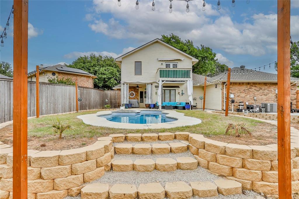 $10K PRICE DROP! This RARE Arlington gem delivers a lifestyle of space, comfort, and backyard resort living with no HOA, an oversized lot, and a private pool oasis just minutes from everyday conveniences, major employers, and entertainment. Located in a well-established neighborhood off Nine-Mile Creek and near Lake Arlington, this home places you near I-20, Highway 360, and SH 303 for effortless commuting to The Parks at Arlington, Globe Life Field, AT&T Stadium, Six Flags Over Texas, and dining and retail along Matlock Road and Cooper Street, with grocery stores like Kroger, Sprouts, Walmart, Target, fast casual favorites, coffee shops, and restaurants just a short drive away. Inside, the traditional floor plan offers generous living spaces including a welcoming living room with a wood-burning fireplace and bay window, a formal dining room accented by chair rail molding, and an island kitchen featuring granite countertops, stainless appliances, travertine backsplash, updated lighting and hardware, abundant cabinetry, breakfast bar, and cozy eating area with window seat and built-in hutch. The main level primary suite provides bay window views and an ensuite bath with dual sinks, a separate shower, jetted tub, and walk-in closet, while upstairs you’ll find a large game room with balcony access, three additional well-sized bedrooms, and a full bath. Updates include fresh interior paint, newer HVAC units under 3 years old, no popcorn ceilings, and the oversized side J-style entry garage with long driveway offers great parking and storage. Step outside to your private backyard sanctuary where a covered patio overlooks the sparkling pool and spa—perfect for entertaining, relaxing, or creating your own outdoor haven. This home truly blends space, location, functionality, and lifestyle in one exceptional Arlington address.
