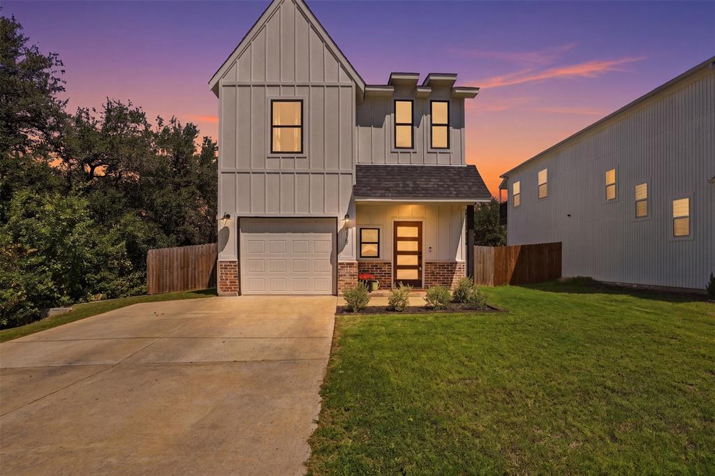 Discover this beautifully crafted modern farmhouse. Offering the perfect blend of style, warmth, and functionality. Built in 2022, this thoughtfully designed 3-bedroom, 2.5-bath home features a bright open-concept layout filled with upscale finishes and timeless charm.

The kitchen is truly the centerpiece of the home, showcasing quartz countertops, custom cabinetry, open shelving, a farmhouse sink, oversized island, and a stunning herringbone tile backsplash. The inviting living space features luxury vinyl plank flooring, an electric fireplace, and abundant natural light, creating an ideal setting for both everyday living and entertaining.

Upstairs, you’ll find spacious bedrooms including a relaxing primary retreat complete with a custom closet system and a beautifully finished ensuite featuring dual vanities and a walk-in shower. Even the laundry room was designed with style in mind, offering built-in storage cabinetry.

Step outside to a fully fenced backyard with plenty of room for entertaining, pets, or enjoying peaceful evenings. Located in the Comanche Cove community, residents enjoy neighborhood amenities while being just minutes from Lake Granbury, local shopping, dining, and entertainment.