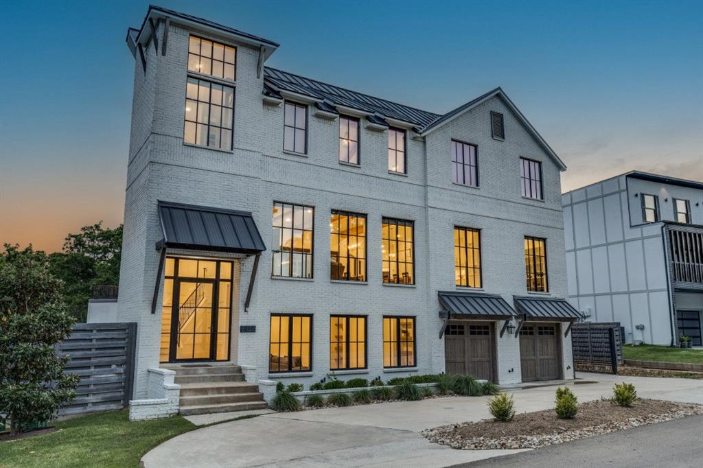 Wind down your day with beautiful views of the sunset over Grapevine Lake! This spectacular newer home in sought-after Flower Mound is just steps away from one of a few sandy beaches at Grapevine Lake and showcases treetop views of the lake from nearly every room. Outdoors, enjoy a resort-style deck replete with a stunning custom pool and spa, built-in grilling area, and fire pit — perfect for relaxing and entertaining friends and family alike. The gourmet kitchen is a chef's delight with stainless steel appliances, a 48” gas range, dual dishwashers, built-in refrigerator, hidden microwave, beverage refrigerator, ice maker, quartz counters and stone backsplash, custom cabinetry, and a handsome kitchen island. The serene primary suite offers a true spa-like retreat with lake views, a beamed vaulted ceiling, balcony, spacious walk-in closet with built-ins, and a bath with a glass-enclosed shower, luxurious marble tile, large soaking tub, and dual vanities. Elevator-ready, this home features three additional ensuite bedrooms, a grand fireplace in the main living room, and an accordion sliding-glass wall that adjoins the gourmet kitchen, dining area, and deck area with the elevated pool and spa. Additional amenities include a game-media room, study, two powder baths, three car-garage, a mudroom, two full-size laundry rooms, and an outdoor staircase from the deck to the lawn. With access to the highly acclaimed schools in Lewisville ISD, this exceptional home at 6903 Red Bud Dr provides a dream setting for indoor-outdoor living, all within a footpath walk to Grapevine Lake and a 20-minute drive to DFW Airport.