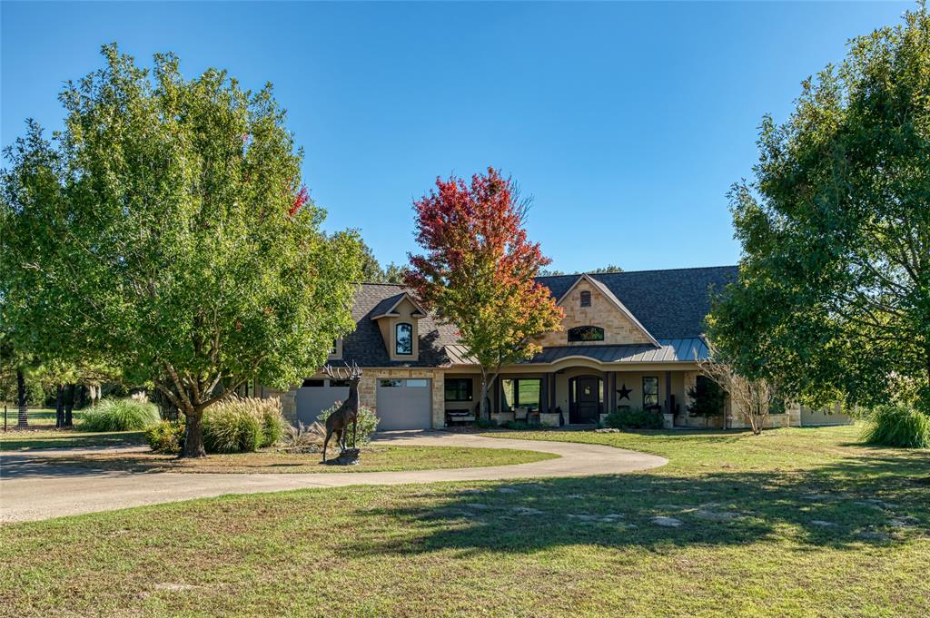 Exquisite 56 Acre Experience serene country living on this stunning 55-acre ranch featuring three beautiful homes, a private workshop apartment, and a scenic ponds. The main residence spans 3,630 sq ft with 4 bedrooms and 3 baths, highlighted by cathedral ceilings, a grand foyer, and multiple outdoor living spaces—including a wraparound front porch, a peaceful courtyard, a covered side patio with a wood-burning fireplace, and two rear patios overlooking 2 acre pond. The primary suite offers a cozy sitting area with its own fireplace and a spa-inspired bath with dual vanities, a soaking tub, oversized glass-enclosed shower, and water closet. A guest home, with approx. 2,000 sq ft, feature 3 bedrooms, 2 baths, and attached 2-car garages, ideal for extended family or guests. A well-appointed workshop includes a 1-bedroom apartment with full kitchen, living room, and bath 495 sq ft. Outdoors, enjoy a 2-acre deep-water pond with pier—perfect for fishing and relaxation. The property is fully fenced with an electric gated entrance and chip-and-seal driveway, while the main home enjoys its own private gated entry. Located just minutes from Emory, this exceptional ranch offers refined country comfort, privacy, and versatility—ideal as a family estate, retreat, or multi-generational homestead.