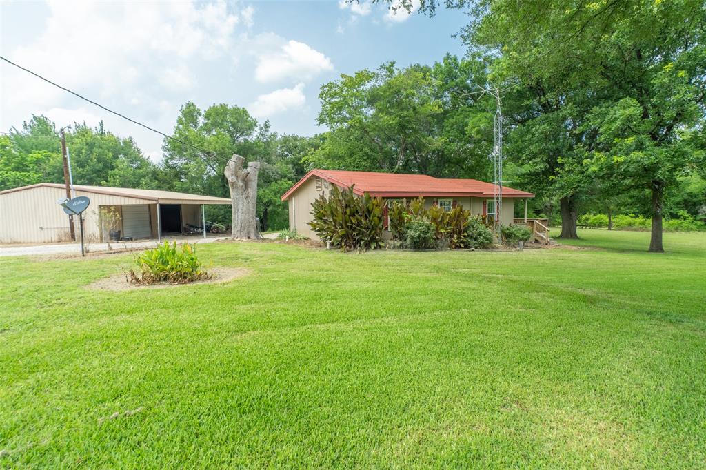 Lucky for you, financing fell through for the previous buyers and we are back on the market!! Enjoy this one-of-a-kind property with acreage and plenty of privacy!  You'll find the main house with spacious rooms and a large porch perfect for entertaining or simply enjoying the view. The roof was just replaced August 2023. There is a mobile home, which could be used for extra income when rented out, or could be used as a guest house. A large workshop also sits on the property with covered parking, electricity, and an electric opener for the large doors. Plus, there's an RV pad with hookups. This lush countryside property backs up to a creek leading to the lake. The possibilities are endless! There are 3 parcels of land which will be sold together. The mobile home address is 7957 Telegraph Rd. Owner financing available with terms. All information deemed reliable but should be confirmed by buyer and buyers agent.