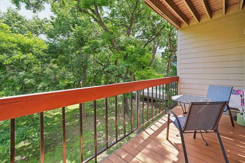Fantastic, move-in-ready condo in Richardson ISD with beautiful greenbelt and creek views from every window! This rare floor plan offers direct access to your own attached private garage, featuring a professionally painted and treated garage floor. Recent updates include large energy-efficient windows in the downstairs primary suite, newer water heater, and an updated primary bath with granite countertops, tile finishes, a spacious walk-in shower, and a large walk-in closet. Upstairs, enjoy an open-concept kitchen with granite countertops and a floating stainless steel vent hood overlooking the living room with a cozy fireplace. A half bath and spacious balcony provide the perfect space to relax and take in the peaceful greenbelt views. Conveniently located near shopping, dining, and entertainment. HOA covers water, sewer, trash, mowing, and landscaping. A super cute condo in excellent condition with a serene natural setting!