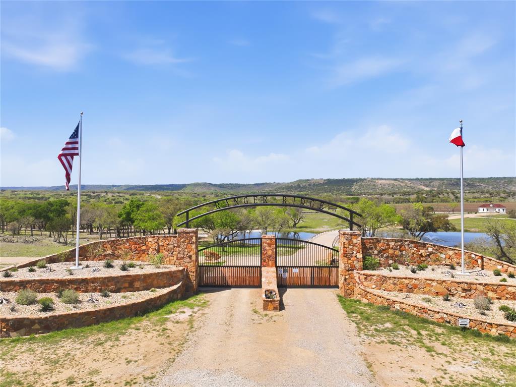 Live on a working ranch—without any of the work! Welcome to Ranger Ridge, an exceptional luxury ranch community where country club amenities and outdoor adventure come together just one hour west of Fort Worth. Build your custom ranch home with concierge-style service on one of 100 exclusive homesites ranging from 5 to 8 acres, designed for those seeking space, privacy, and an unparalleled lifestyle. Spanning more than 3,000 acres of rolling pastures and over 800 acres of private estates, Ranger Ridge offers endless opportunities to enjoy the outdoors. Residents have access to country club-style amenities, a private helipad, equestrian facilities, stocked fishing ponds, and a breathtaking wildlife preserve featuring more than 60 species of exotic animals. Customizable membership experiences allow you to tailor the ranch lifestyle to your family's interests. Lot 30 is a beautiful, level homesite offering exceptional ease of construction and limitless possibilities for your custom dream home. Situated in the heart of Ranger Ridge's diverse landscape, this prime property is surrounded by roaming wildlife and sweeping open spaces, creating a truly immersive ranch experience. Enjoy tranquil surroundings, scenic views, and a peaceful setting while remaining conveniently close to the community's premier amenities. Ideally located near Palo Pinto Mountains State Park, Possum Kingdom Lake, and The Cliffs Resort, Ranger Ridge places recreation, relaxation, and adventure right at your doorstep. Come discover where luxury, nature, and freedom meet. We'll see you at the Ranch!