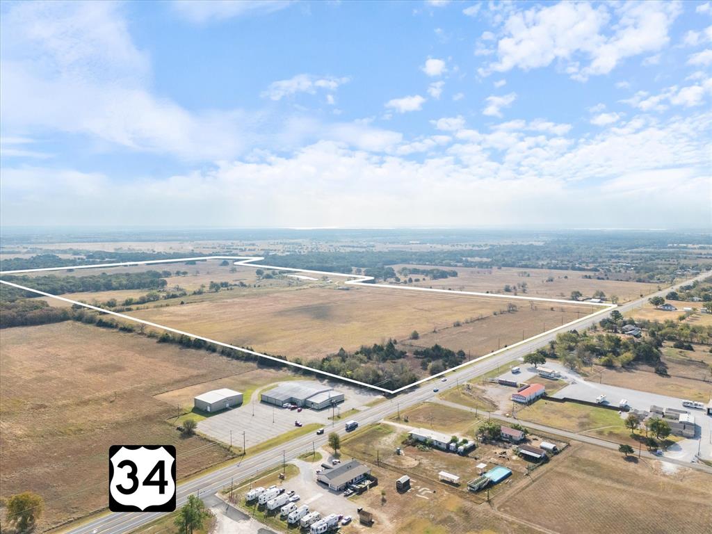 Little Creek Ranch is a ±189-acre tract on State Highway 34, located in a growth corridor just 5 miles south of I-30 in Greenville and 3 miles from L3Harris. With ±1,704 feet of highway frontage, a 6-inch Cash SUD water line along the east side, and no pipelines, the property offers flexibility for a range of development opportunities. It lies outside the city limits and ETJ of both Greenville and Quinlan, is currently AG exempt, and features five ponds. A transmission line runs southeast, with the majority of the land remaining open and usable. Existing structures, including a mobile home, do not contribute to the property's value.

With excellent access to transportation routes, utilities, and regional employers, Little Creek Ranch is well-positioned for residential, commercial, or mixed-use development. Its size, location, and natural features make it a strong option for both immediate and long-term investment.