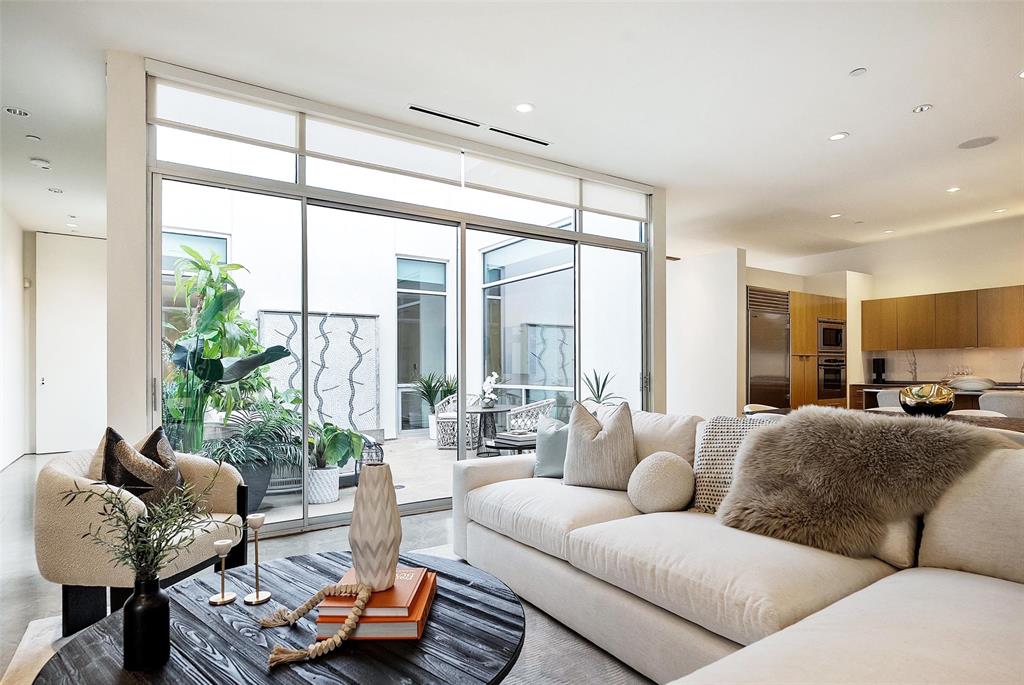 Welcome to Art House Unit 3B, a boutique architectural landmark in the heart of Oak Lawn, where contemporary design, privacy, and city-center convenience converge. With just eight residences, Art House offers a rare combination of exclusivity, elegance, and sculptural living — a sanctuary for those who value both form and lifestyle.

Unit 3B, designed by acclaimed architect Lionel Morrison, is a top-floor, treetop retreat centered around a private open-air courtyard. Floor-to-ceiling windows, expansive skylights, and soaring museum-finish walls frame a light-filled, gallery-like interior, while a private courtyard with a tranquil fountain creates a serene indoor-outdoor connection.

The sculptural kitchen is as functional as it is elegant, with stainless steel countertops, an oversized breakfast island, and premium Sub-Zero appliances, ideal for hosting intimate gatherings or celebratory dinners.

This residence features two refined bedroom suites, two-and-a-half baths, a glass-enclosed office, polished concrete floors, a dedicated utility room, two garage spaces, and private storage — all curated for elevated modern living. 

Experience the rare opportunity to own a museum-quality, treetop residence in one of Dallas’ most architecturally significant boutique communities, where light, design, and lifestyle unite in perfect harmony.