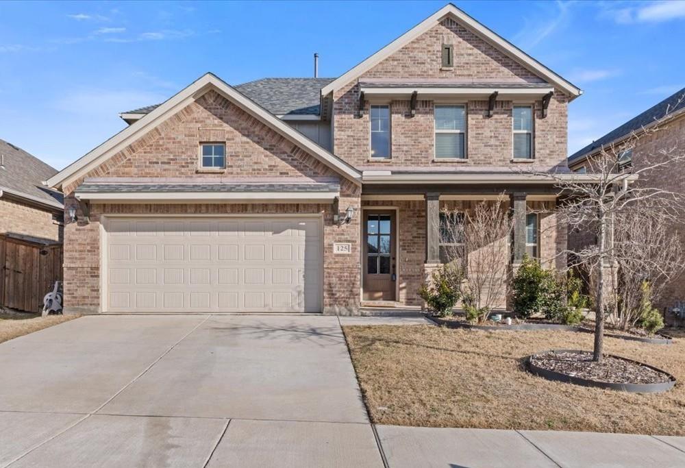 This inviting two-story brick home offers 4 bedrooms and 2.5 bathrooms, with the primary suite conveniently located downstairs. The primary bedroom features an en-suite bathroom with dual vanities and a walk-in closet, providing a peaceful retreat. The open floor plan includes a spacious living room with a cozy fireplace, and ceramic wood look tile flooring extends throughout the main living areas for a sleek, low-maintenance finish. The kitchen is connected to a charming breakfast nook, perfect for casual meals, while the formal dining room is situated at the front of the home, offering a more elegant space for gatherings. Upstairs, you'll find three additional bedrooms with plush carpeting and a full bathroom. Upstairs, you'll find a second living area that adds versatility for use as a playroom, media room, or home office. The large backyard is ideal for outdoor activities, with a covered patio offering a shaded space for enjoying the outdoors. The 2-car garage provides ample parking and storage. This home is perfectly designed for comfortable living, with well-defined spaces for both everyday use and formal occasions.
